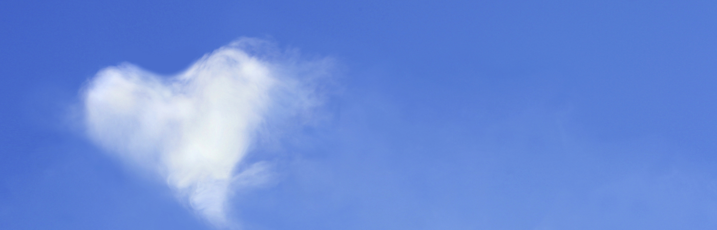 Heart-shaped cloud in a blue sky