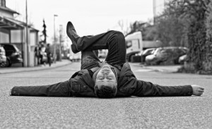 man laying in street